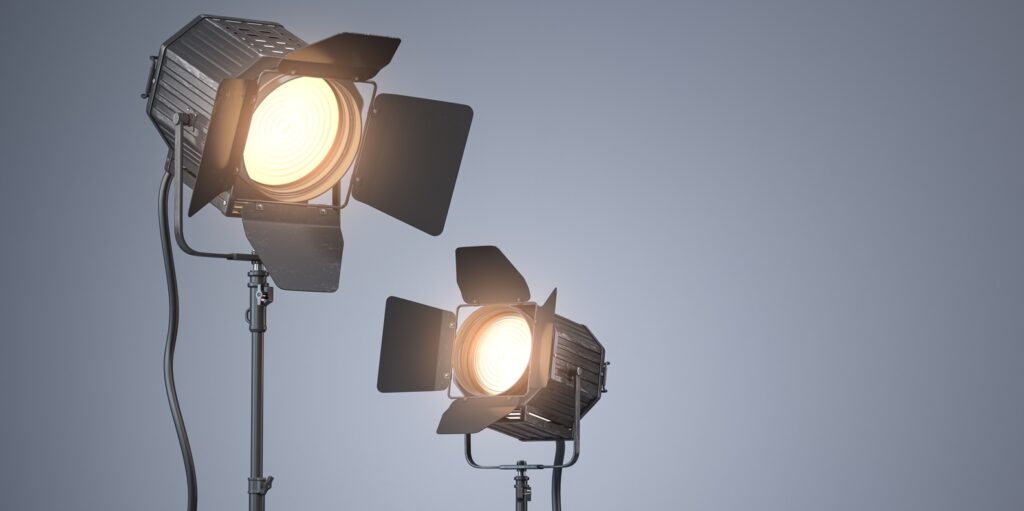 Spotlight studio lighting equipment for photography or videography on grey backgound.