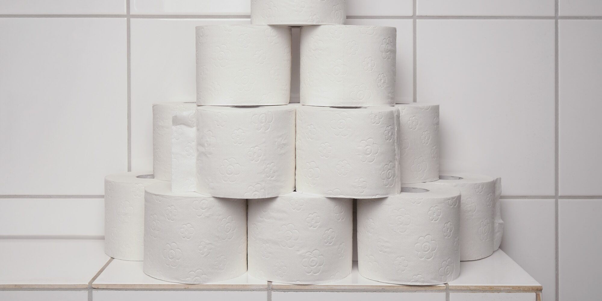 many rolls of toilet paper stacked and hoarded