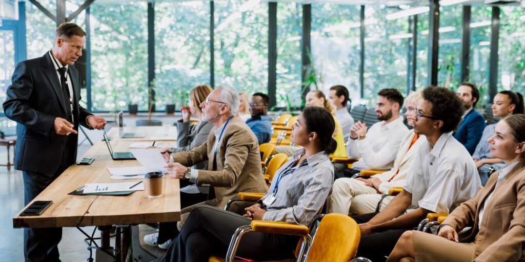 Cinematic image of a conference meeting.
