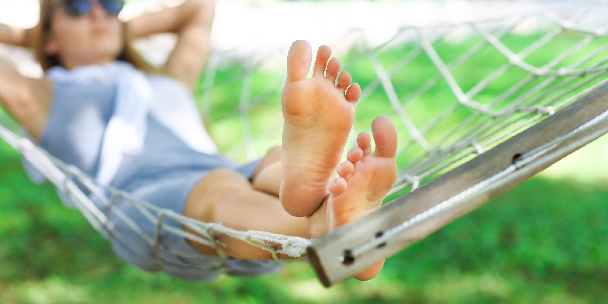 Lazy time. Woman in a hammock